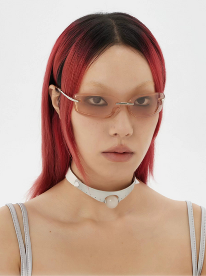 Futuristic Half-Rim Sunglasses — Model wearing half-rim glasses with light lenses