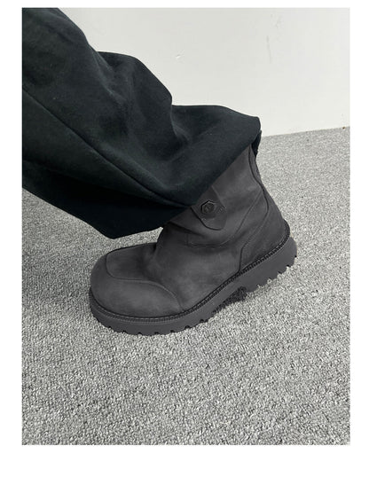 Gray suede winter boot worn with dark trousers, side view