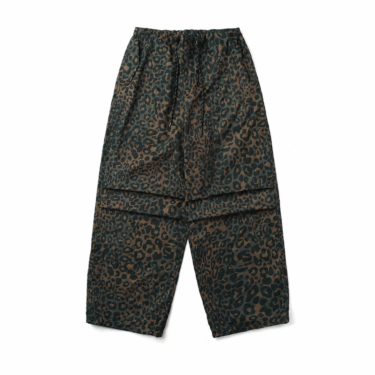 Moss green leopard print parachute pants with pleated knees and drawstring waist