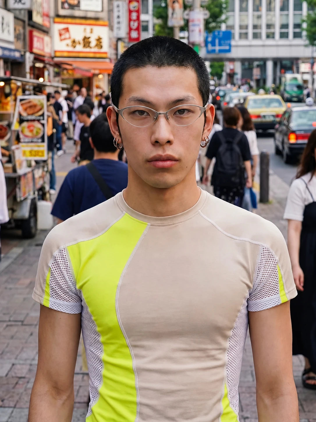 Model wearing silver-tone metal cat-eye glasses on a city street