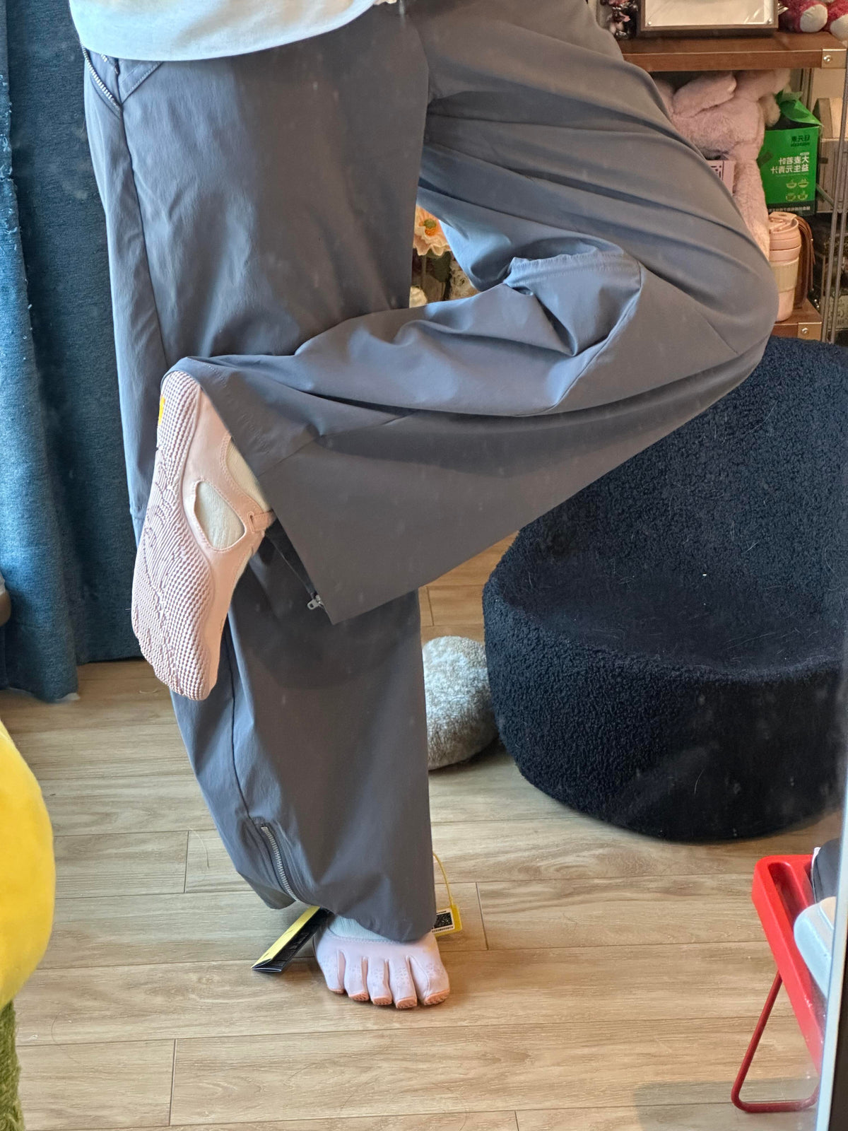 Pink FiveFingers V-Soul shoes styled with gray wide-leg pants