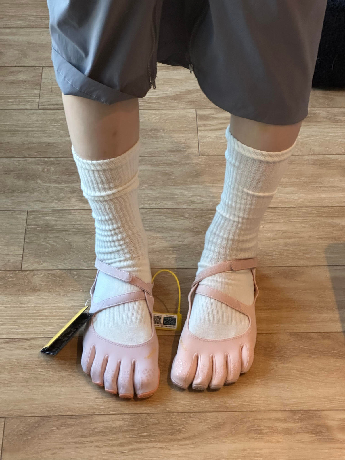 Pink FiveFingers V-Soul shoes worn with white socks and dark shorts
