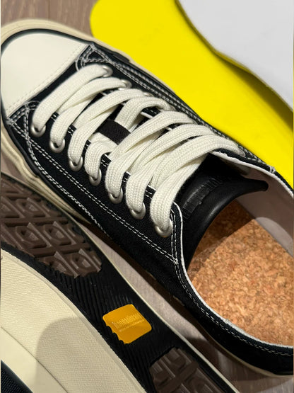 Platform Canvas Low-Top Sneakers — black canvas laces and eyelets, close-up