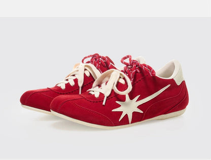 red training shoes pair side