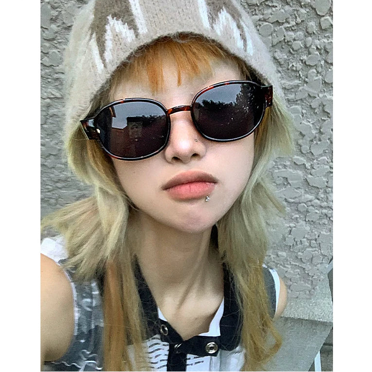Retro Metal Tinted Sunglasses — Model wearing dark retro metal sunglasses with knit hat