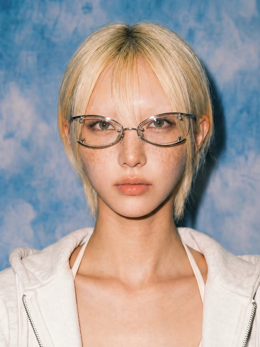 Model wearing silver Retro Rectangular Metal Glasses with clear lenses and a grey hoodie