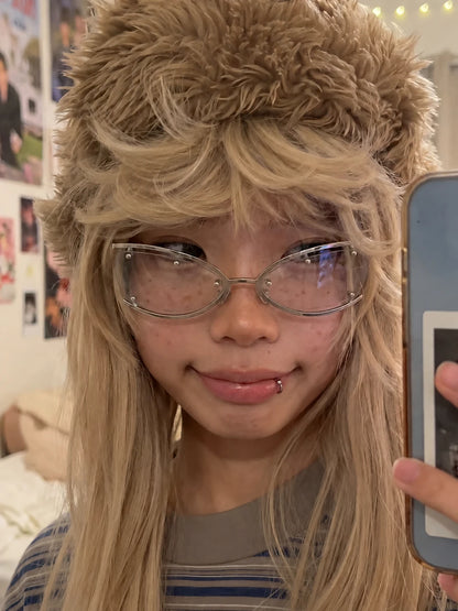 Mirror selfie of a model wearing silver Retro Rectangular Metal Glasses and a brown furry hat