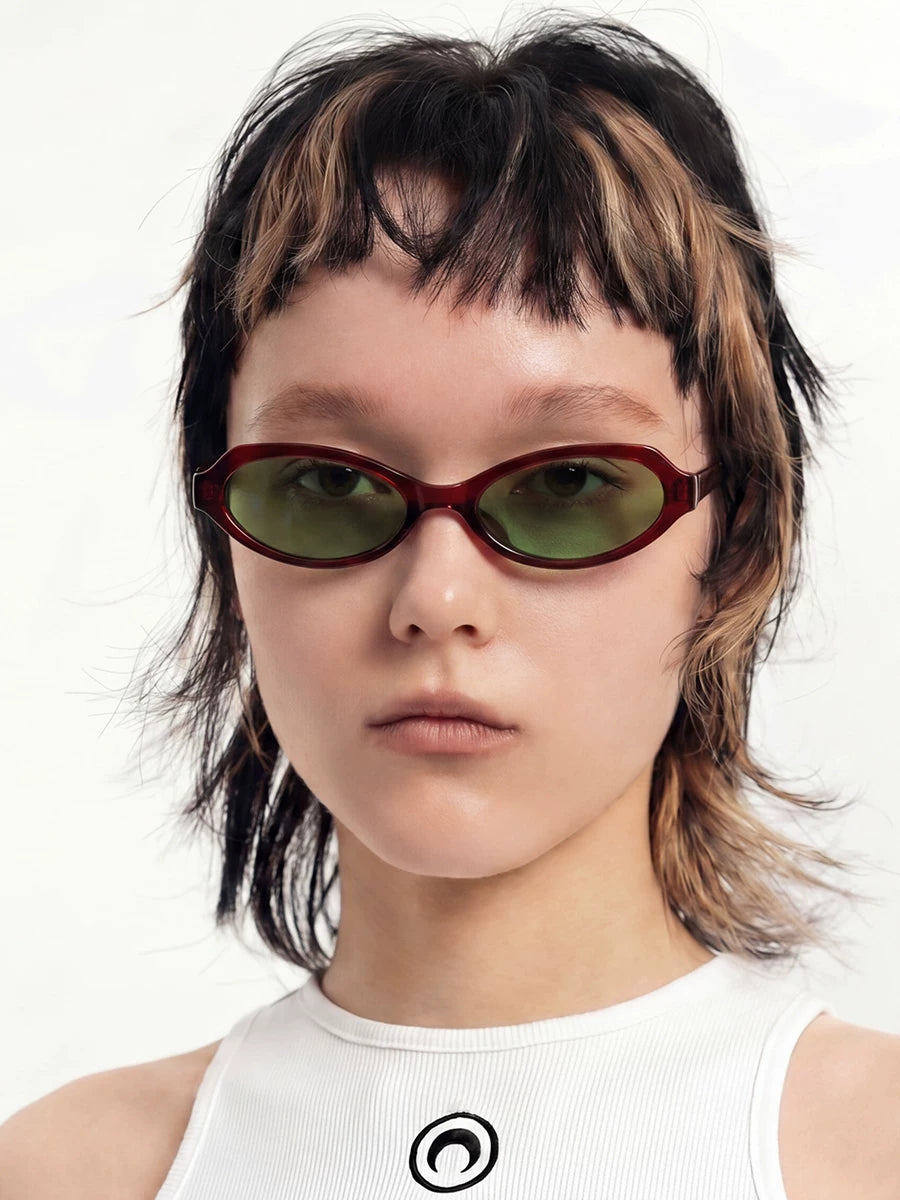 Retro Rounded-Square Sunglasses — Model wearing burgundy sunglasses with green lenses