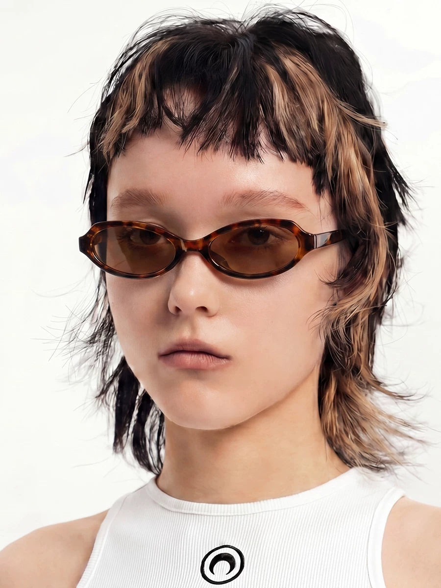 Retro Rounded-Square Sunglasses — Model wearing tortoiseshell sunglasses with brown lenses