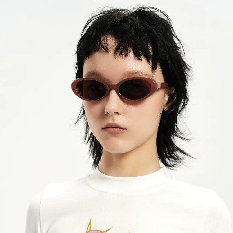 Retro Small-Oval Sunglasses — Model wearing brown oval sunglasses