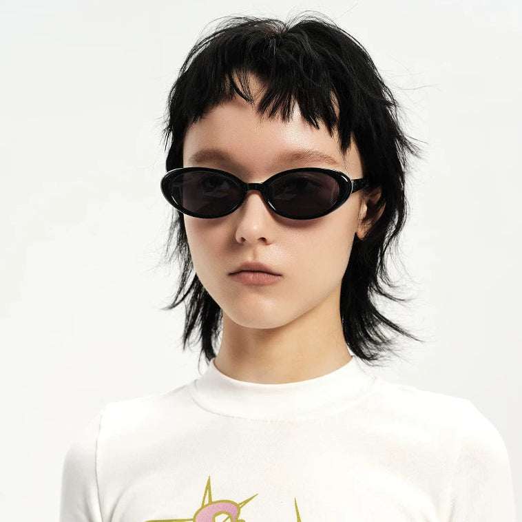 Retro Small-Oval Sunglasses — Model wearing black oval sunglasses