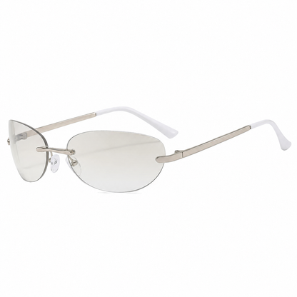 Rimless sunglasses with pale gradient lenses, silver-tone bridge and temples, and white temple tips on a white background.