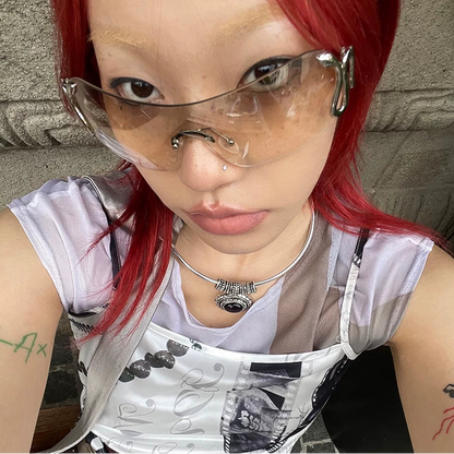 Serpentine Rimless Shield Sunglasses — Model wearing light rimless shield glasses, selfie