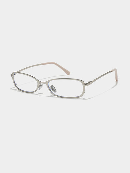 Slim Rectangular Metal-Frame Glasses — Silver-tone frame with clear lenses, three-quarter view