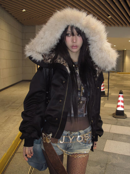 Front outfit view of a black bomber jacket with the fur-look trimmed hood raised