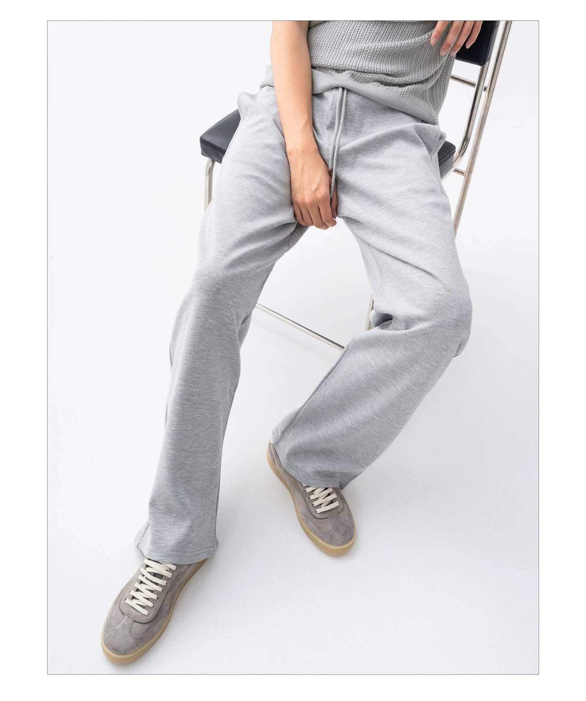 Suede Leather German Trainer Sneakers styled with grey wide-leg trousers
