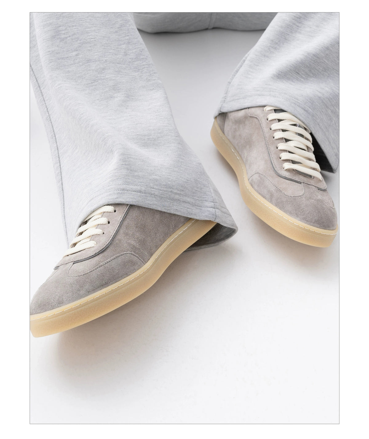 Suede Leather German Trainer Sneakers styled with grey wide-leg trousers
