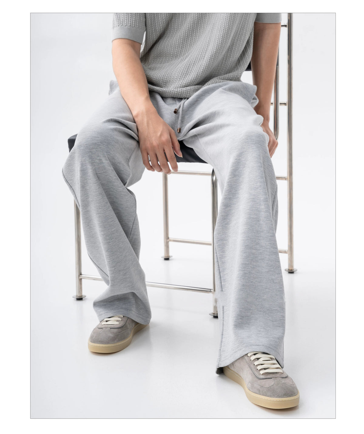 Suede Leather German Trainer Sneakers styled with grey wide-leg trousers