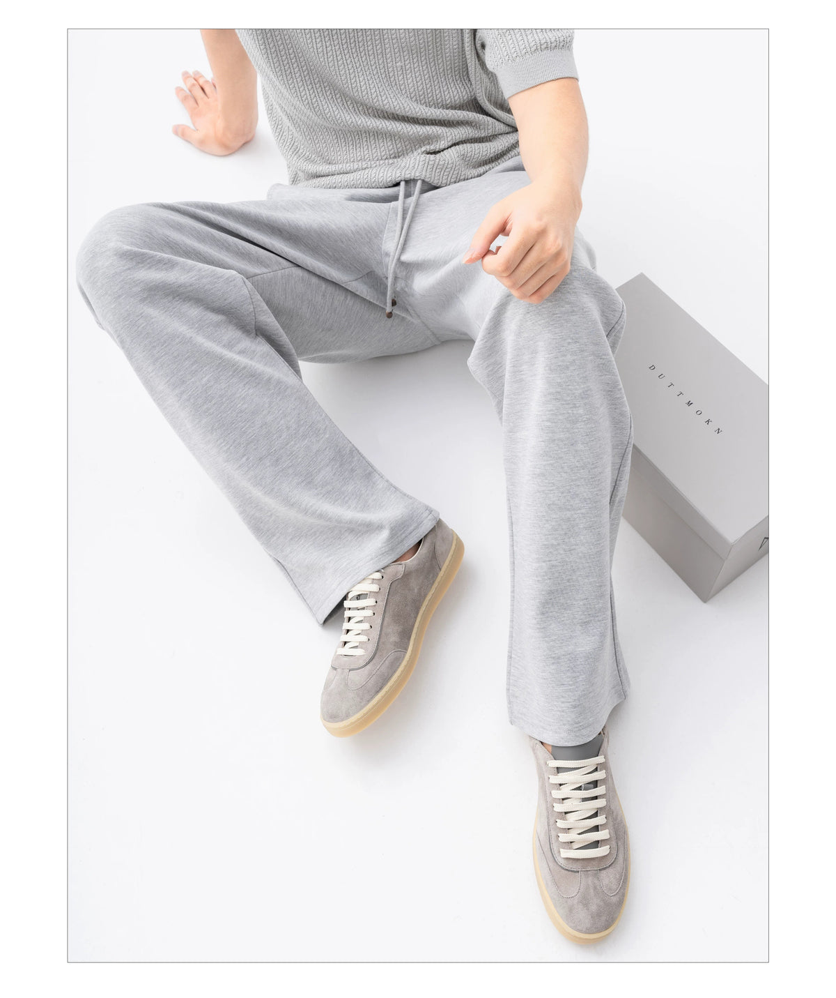 Suede Leather German Trainer Sneakers styled with grey wide-leg trousers