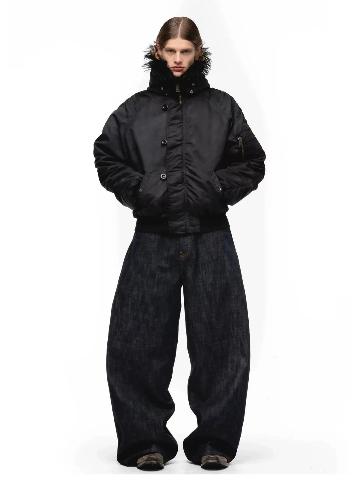 Tie-Dye Bomber Jacket — Model wearing black jacket with black trousers, front view