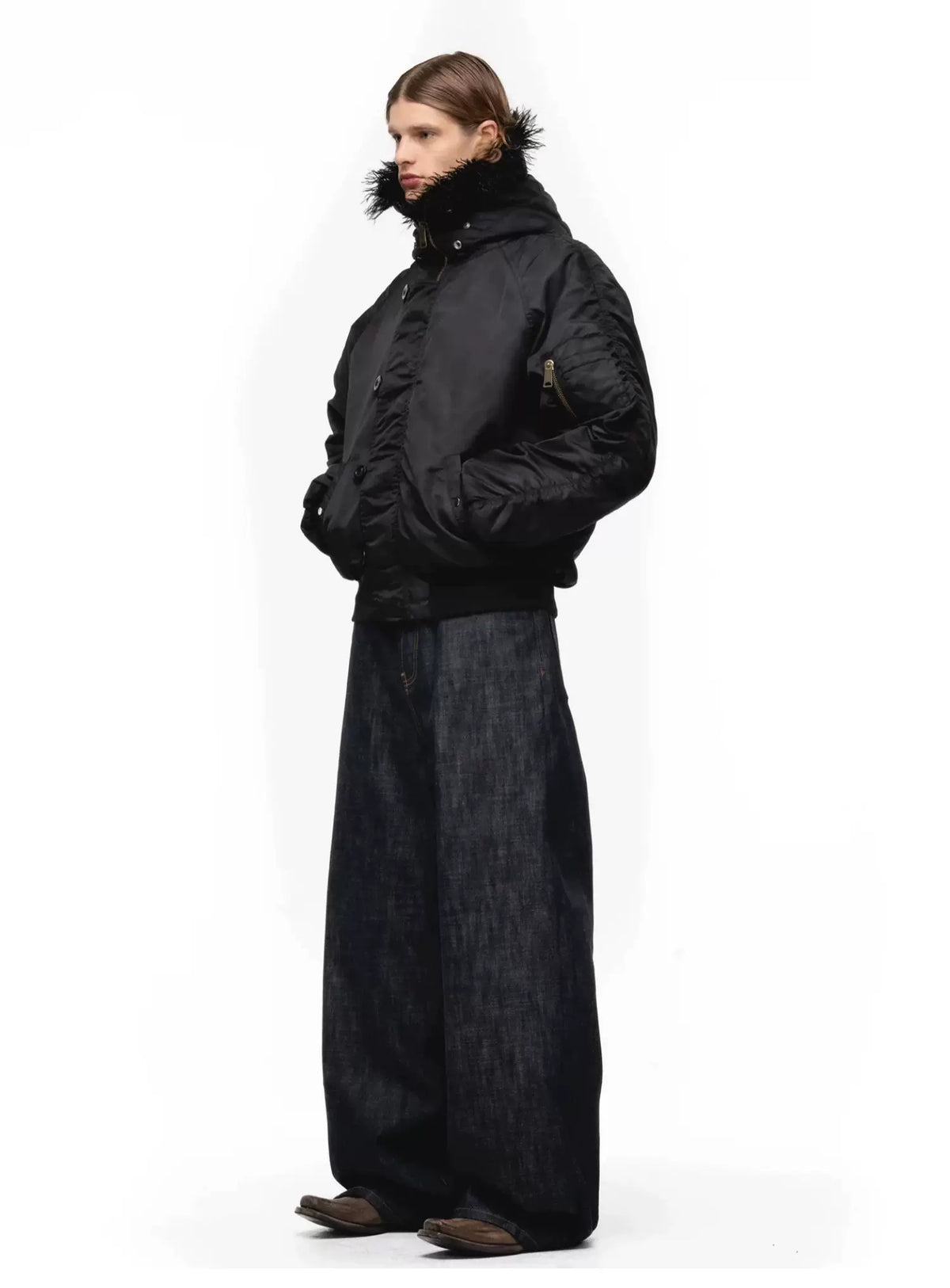 Tie-Dye Bomber Jacket — Model wearing black jacket with black trousers, side view