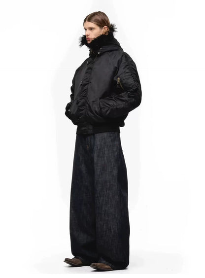 Tie-Dye Bomber Jacket — Model wearing black jacket with black trousers, side view