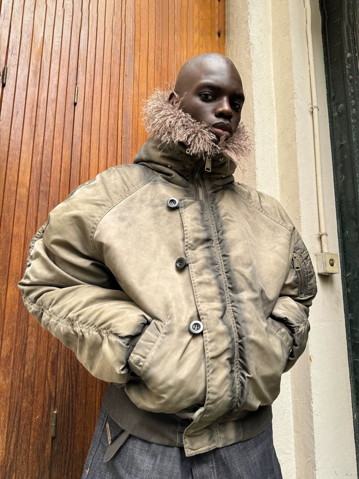 Tie-Dye Bomber Jacket — Model wearing khaki jacket outdoors