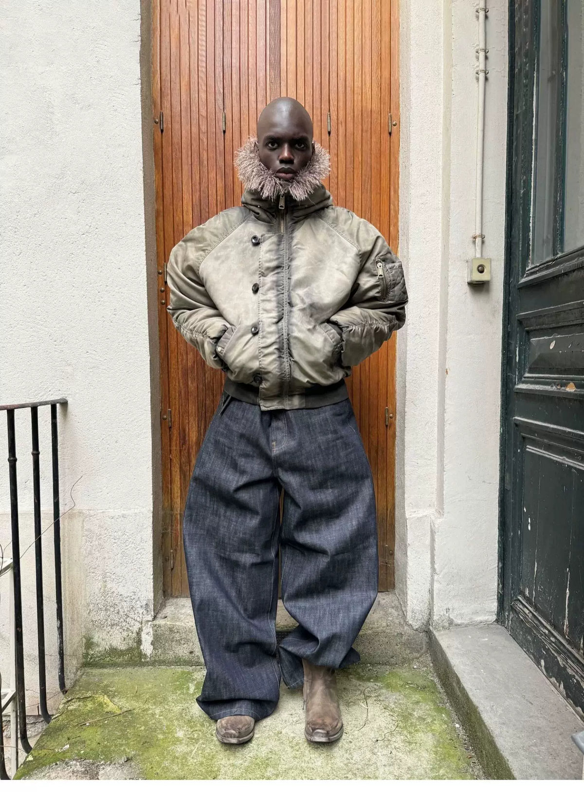 Tie-Dye Bomber Jacket — Model wearing khaki jacket with wide-leg trousers