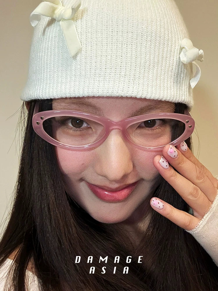 Upswept Cat-Eye Clear-Lens Glasses — Model wearing pink clear-lens cat-eye glasses with knit hat, front view