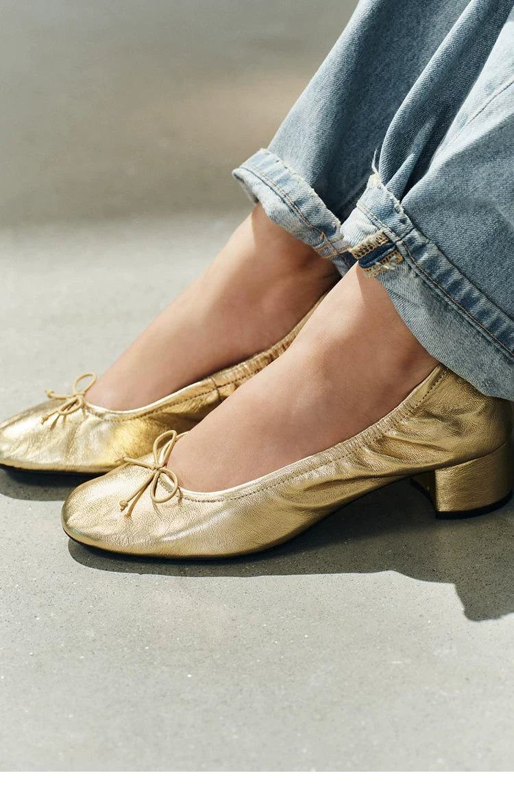 Women's Bow Block-Heel Ballet Pumps — gold bow shoes worn, close-up