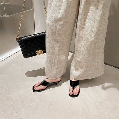 Women's Square Toe Mid-Heel Thong Slide Sandals — black thong mules worn with cream trousers