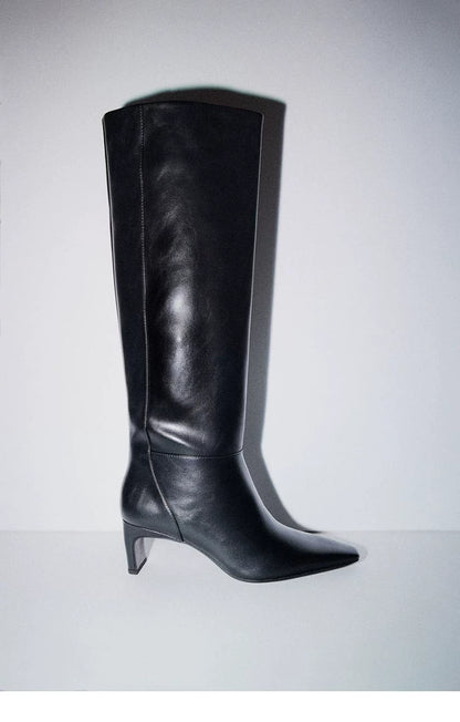 Women's Square Toe Sculptural Heel Knee-High Boots — black pair, side view on grey background