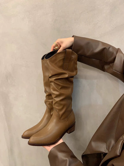 Women's V-Cut Western Knee-High Boots — brown boot held in hand, side view