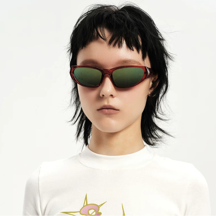 Y2K Angular Wraparound Sunglasses — Model wearing brown wraparound sunglasses with green lenses