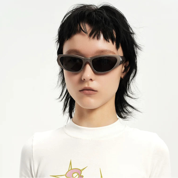 Y2K Angular Wraparound Sunglasses — Model wearing dark wraparound sunglasses