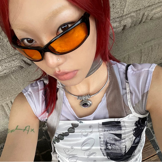 Y2K Square Sport-Inspired Glasses — Model wearing orange-lens square sunglasses, selfie